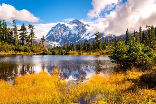 a mountain reflecting in a lake in the mountains at Snowater Nook in Deming