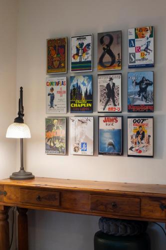 a wall of movie posters on a wall at Villa San Ignacio in Alajuela City
