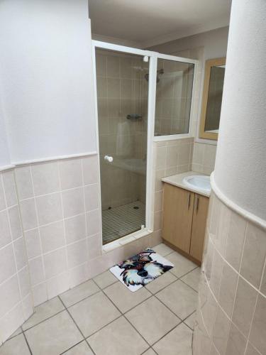 a bathroom with a shower and a sink at 13 at Santos in Mossel Bay