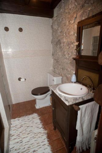 a bathroom with a sink and a toilet and a sink at La Breval in Alles