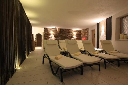 a row of chairs in a waiting room at Landhaus Lechthaler in Sankt Anton am Arlberg