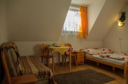 Tempat tidur dalam kamar di Willa Jafer - Zakopane Centrum