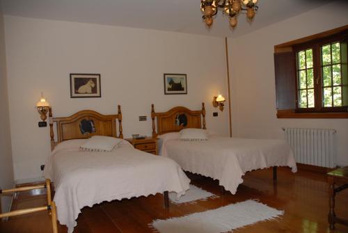 Posteľ alebo postele v izbe v ubytovaní El Urogallo