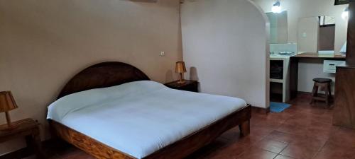 Ένα ή περισσότερα κρεβάτια σε δωμάτιο στο Nosara Paradise Rentals