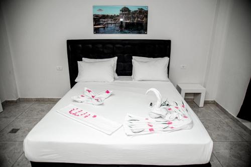 Postel nebo postele na pokoji v ubytování Hotel Maman