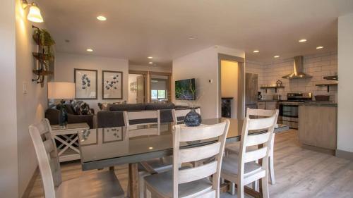 a kitchen and living room with a table and chairs at The Raspberry Garden Luxury Hotel & Suites in Rexburg
