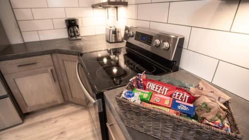 a kitchen with a basket of food on the stove at The Raspberry Garden in Rexburg