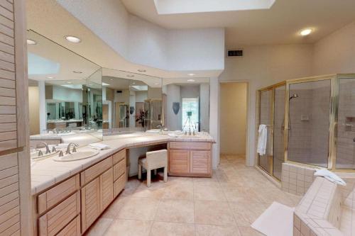 a large bathroom with two sinks and a shower at PGA306 Roomy Single Story PGA West 3 Bedroom in La Quinta