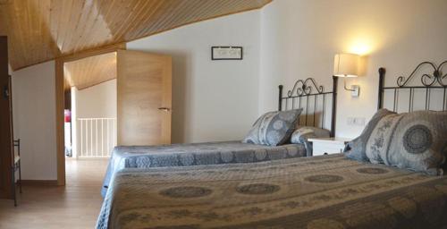 a bedroom with two beds in a room at Casa Corralazos in Castril