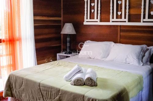 Ένα ή περισσότερα κρεβάτια σε δωμάτιο στο Casa Completa - Nova Petrópolis