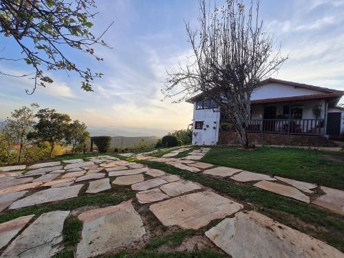 a stone walkway in front of a house at Morada do Chabeco in Lavras Novas