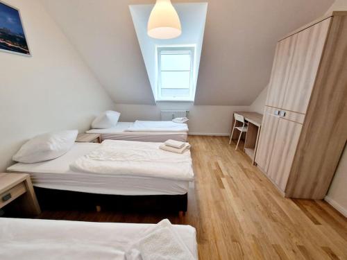 a room with three beds and a window at Charming apartment in the center of Berlin 2142 in Berlin