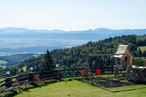 a group of chairs sitting on top of a mountain at Hotel Tisa Pohorje in Pohorje