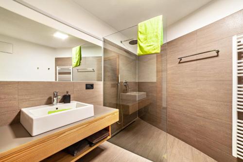 a bathroom with a sink and a shower at Residence Kalchgruberhof Zirbe in Santa Valpurga