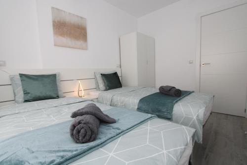 Postel nebo postele na pokoji v ubytování San Rafael Apartment Los Boliches