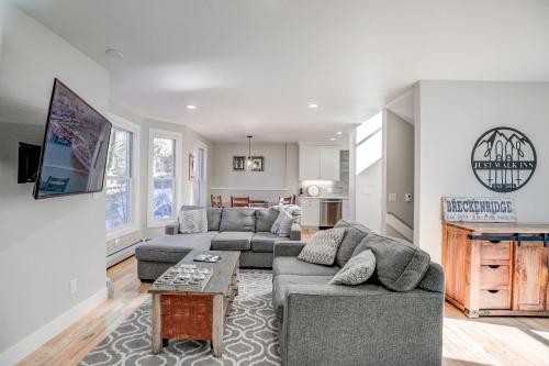 a living room with two couches and a fireplace at Just Walk Inn Townhome: Stroll To Main St, Gondola in Breckenridge
