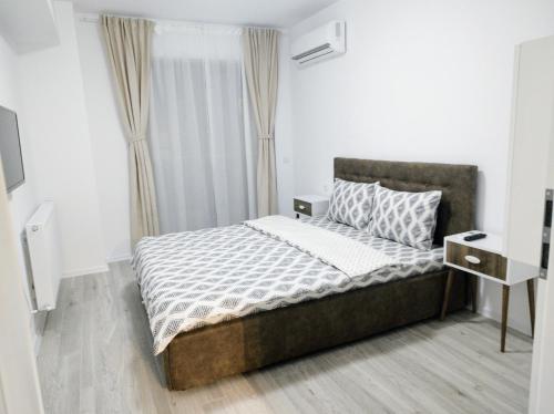 Ένα ή περισσότερα κρεβάτια σε δωμάτιο στο Apartament Ghencea Residence 158 Floor 7