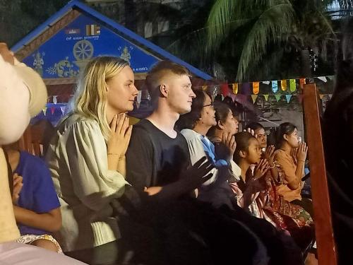 a group of people sitting in a crowd at Kakrona Pouk Homestay in Siem Reap
