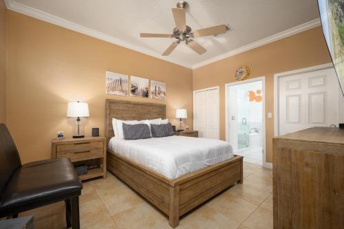 a bedroom with a bed and a ceiling fan at 933 Cinnamon Beach, 3 Bedroom, Sleeps 8, 2 Pools, Elevator, WiFi in Palm Coast