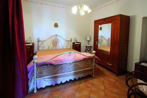 Ένα ή περισσότερα κρεβάτια σε δωμάτιο στο Agriturismo Il Paradiso