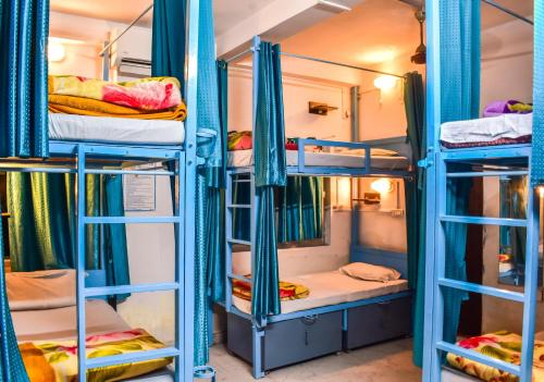 a group of bunk beds in a room at Skyard Rishikesh, Laxman Jhula in Rishīkesh