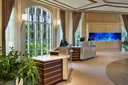 an office with a fish tank in the background at The Westin Cape Coral Resort at Marina Village in Cape Coral