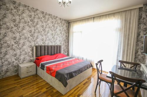 Llit o llits en una habitació de Мини - ГОСТИНИЦА "ЛЮБИМЫЙ ДОМ"