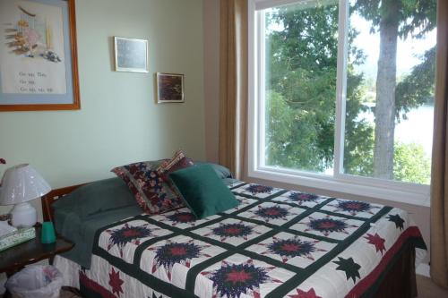 Een bed of bedden in een kamer bij Cycle Inn Bed and Breakfast