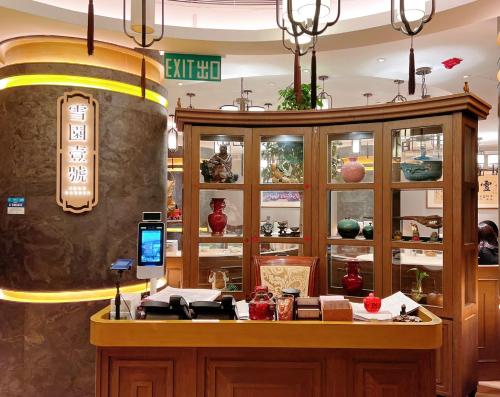 a shop with a counter in a store at South Pacific Hotel in Hong Kong
