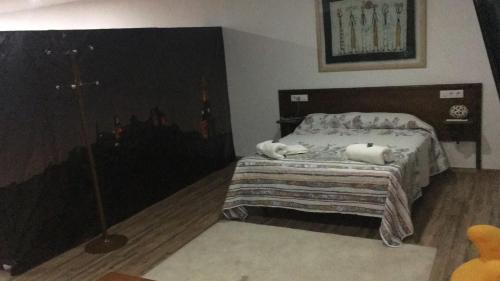 Ein Bett oder Betten in einem Zimmer der Unterkunft Apartamentos el soho