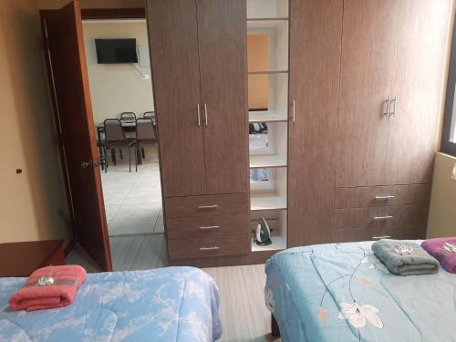 Cama o camas de una habitación en Hospedaje en departamento entero de 2 habitaciones