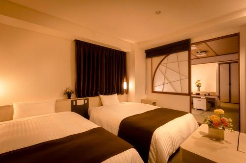 Ένα ή περισσότερα κρεβάτια σε δωμάτιο στο Choshi Plaza Hotel