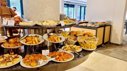 a buffet with many different types of food on display at Kraljevi Konaci Olja in Zlatibor