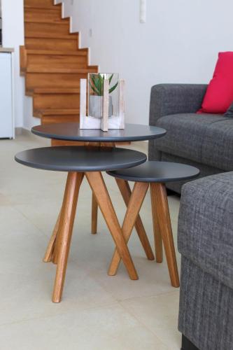a coffee table in the middle of a living room at Cocoon Luxury Villas in Maleme