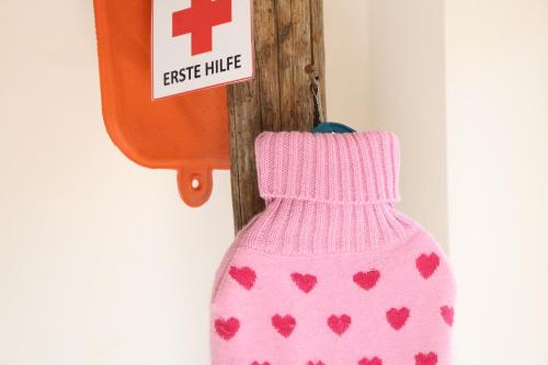 a pink dress with hearts on it next to a sign at Bio Archehof Zachhiesen - stay & relax in Seekirchen am Wallersee