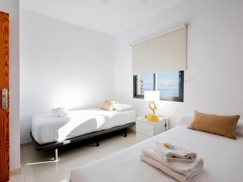 Postel nebo postele na pokoji v ubytování 1301 Very nice apartment with amazing sea view