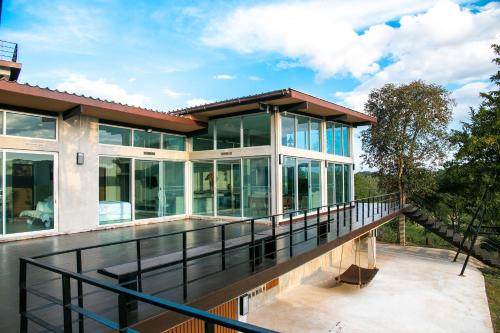 an image of a house with a balcony at Mighty Mountain Thailand in Kaeng Krachan