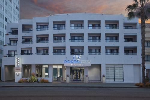 a large white building with a large window at Ocean View Hotel in Los Angeles