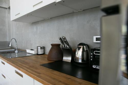 a kitchen with a counter top with a coffee maker at Mighty Mountain Thailand in Kaeng Krachan