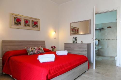 Postel nebo postele na pokoji v ubytování B&B I Gerani