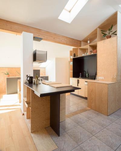 a kitchen with a large island in a room at Montagu Hostel in Innsbruck