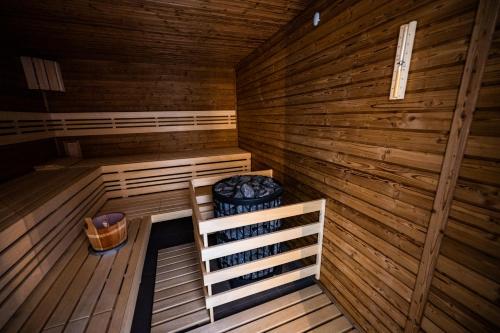 an inside view of a wooden sauna at Wellness & Spa Pila Kvilda AP 2 01 a AP 3 07 in Kvilda