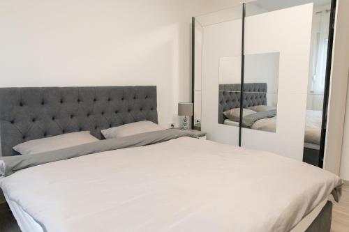 Säng eller sängar i ett rum på Apartman Škrinjar