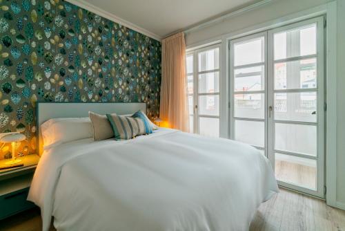 A bed or beds in a room at Morar Ourense