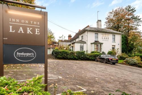 a sign for an inn on the lake in front of a house at Inn on the Lake by Innkeeper's Collection in Godalming