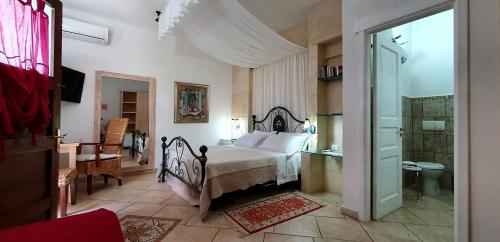 Postel nebo postele na pokoji v ubytování Masseria L'Uliveto Agri Resort