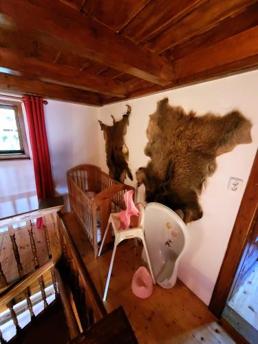an overhead view of a baby room with a crib and a baby crib at Horská chata Kouty in Loučná nad Desnou