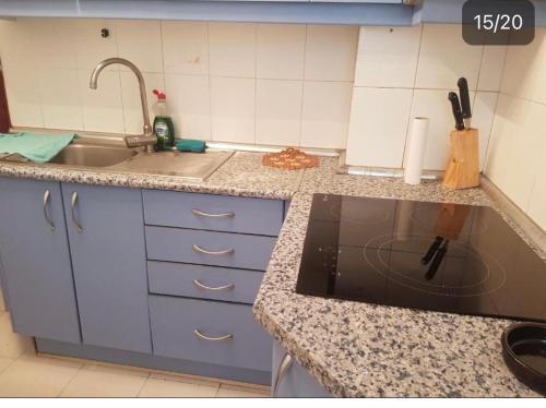 a kitchen with a sink and a counter top at BE LIKE AT HOME PARIS in Alcalá de Henares