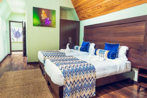 Voodi või voodid majutusasutuse OSOTUA LUXURY RESORT by ICON toas