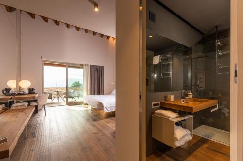a bathroom with a sink and a bedroom at Borgo Corsignano in Poppi